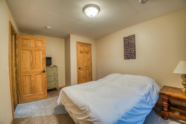 bedroom featuring carpet