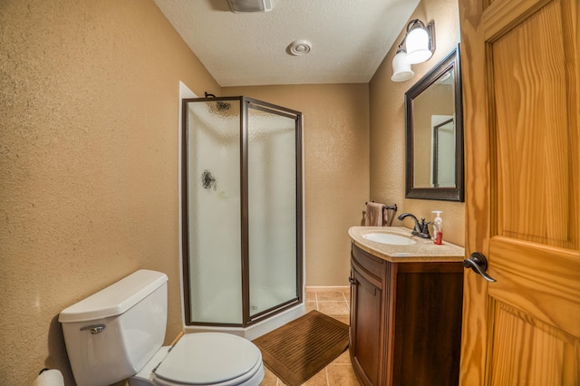 bathroom featuring tile patterned floors, a textured ceiling, an enclosed shower, toilet, and vanity