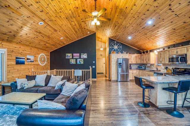 living room featuring ceiling fan, dark wood-type flooring, sink, high vaulted ceiling, and wooden ceiling