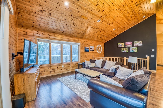 living room with dark hardwood / wood-style floors, high vaulted ceiling, wooden walls, and wood ceiling