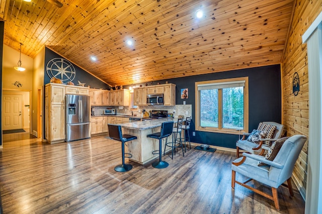 kitchen featuring hardwood / wood-style floors, high vaulted ceiling, wooden ceiling, and appliances with stainless steel finishes