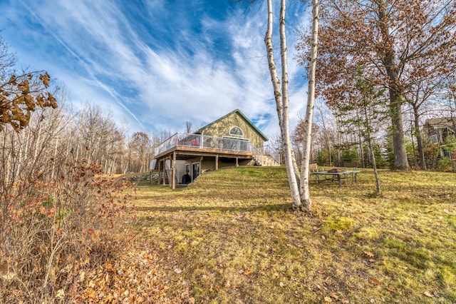 exterior space with a front yard and a deck