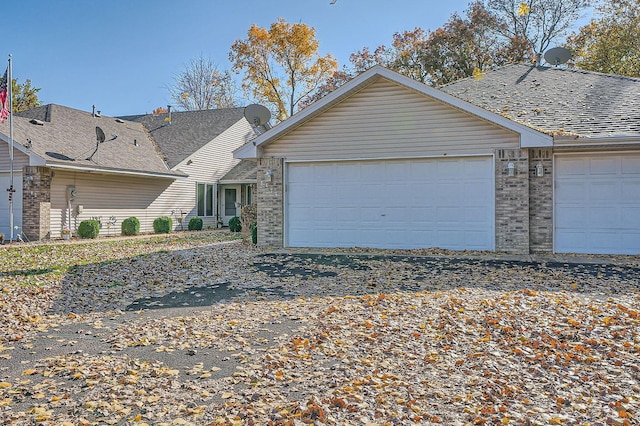 single story home featuring a garage