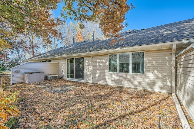 back of property featuring cooling unit