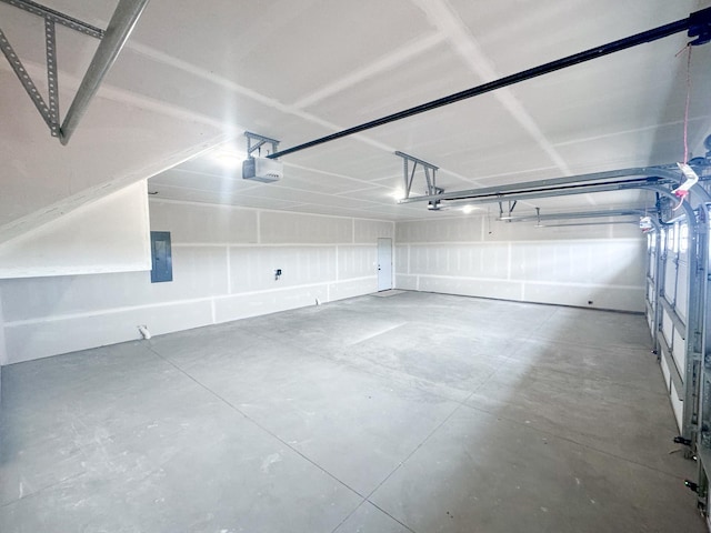 garage featuring a garage door opener and electric panel