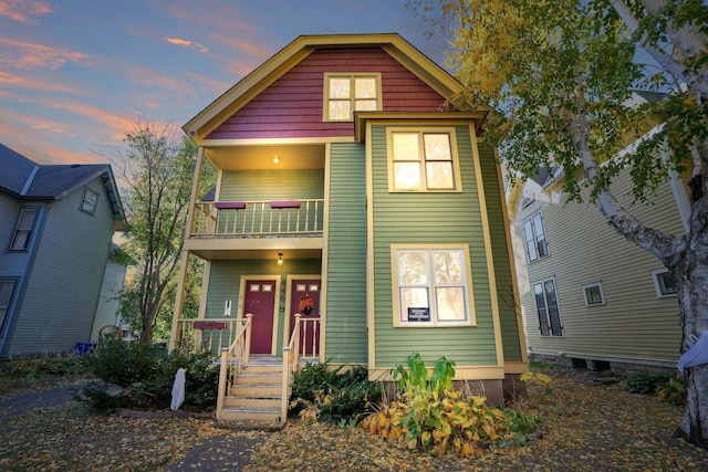 view of front of home with a balcony