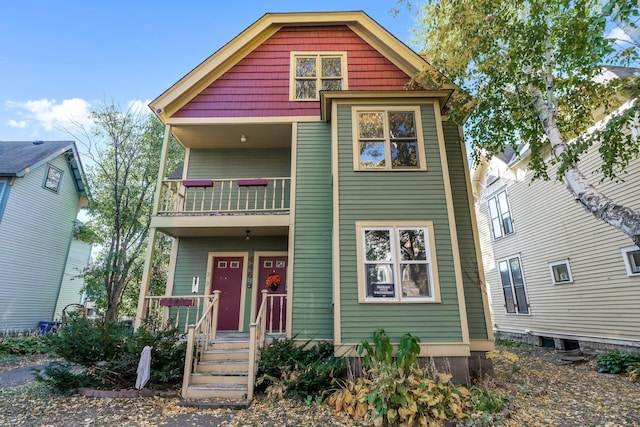 view of front of home with a balcony