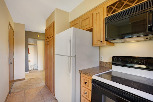 kitchen featuring light brown cabinetry, black appliances, and light tile patterned flooring