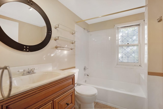 full bathroom featuring vanity, tiled shower / bath combo, toilet, and tile patterned floors