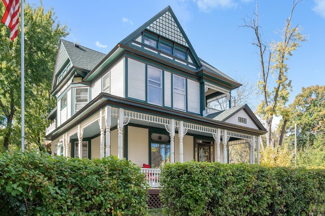 victorian house featuring a porch