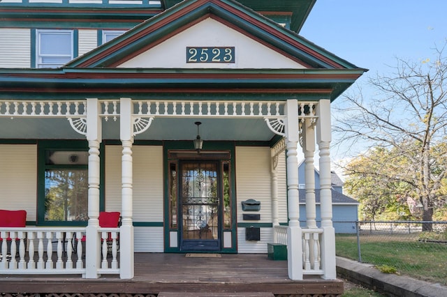 doorway to property featuring covered porch