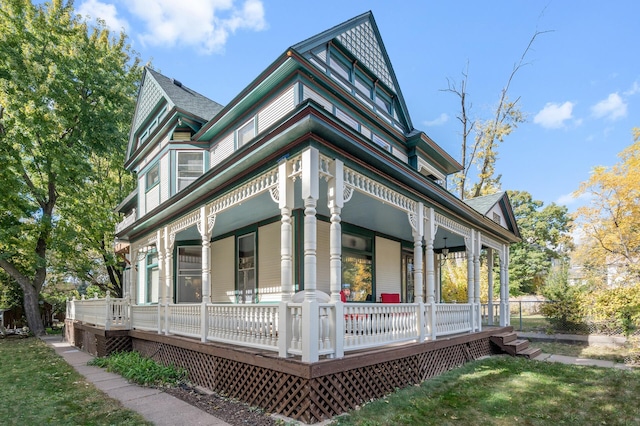 2523 Dupont Ave N, Minneapolis, MN 55411 - view of front facade featuring covered porch and a shingled roof