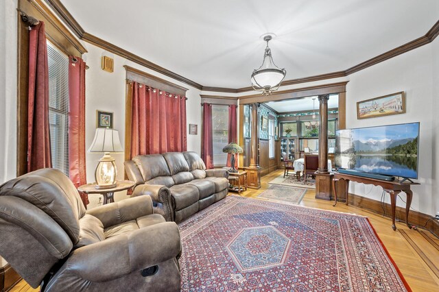 2523 Dupont Ave N, Minneapolis, MN 55411 - living area with ornate columns, ornamental molding, and light wood-style floors