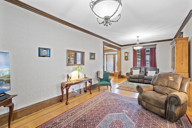 living room with crown molding and hardwood / wood-style floors