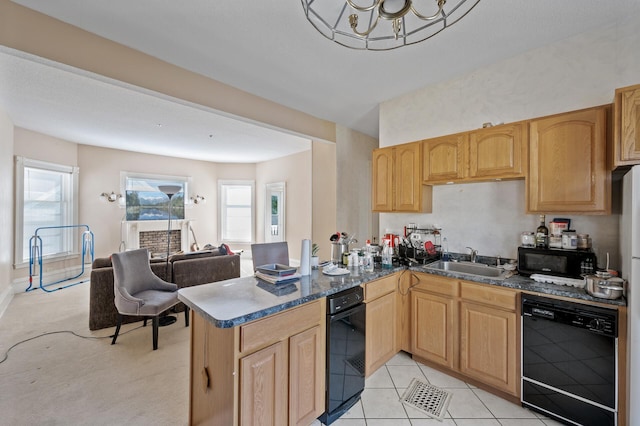 kitchen featuring black appliances, sink, kitchen peninsula, a notable chandelier, and light colored carpet