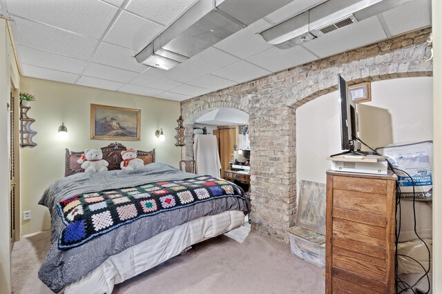 2523 Dupont Ave N, Minneapolis, MN 55411 - bedroom with visible vents, arched walkways, carpet flooring, and a paneled ceiling