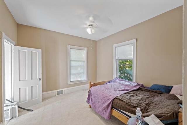 2523 Dupont Ave N, Minneapolis, MN 55411 - bedroom with visible vents, a ceiling fan, and carpet floors