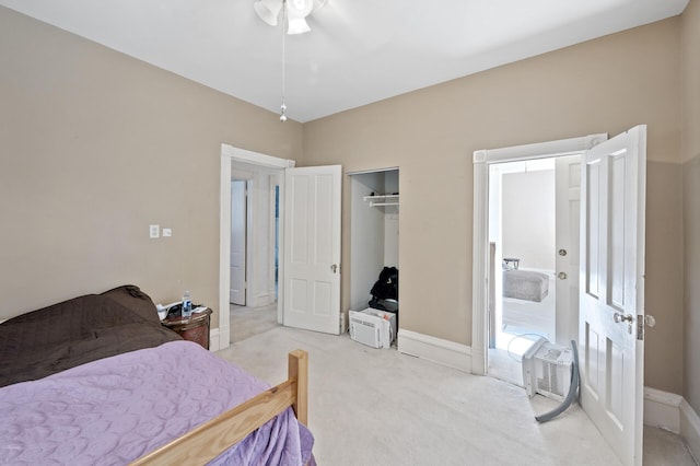 carpeted bedroom with a closet and ceiling fan