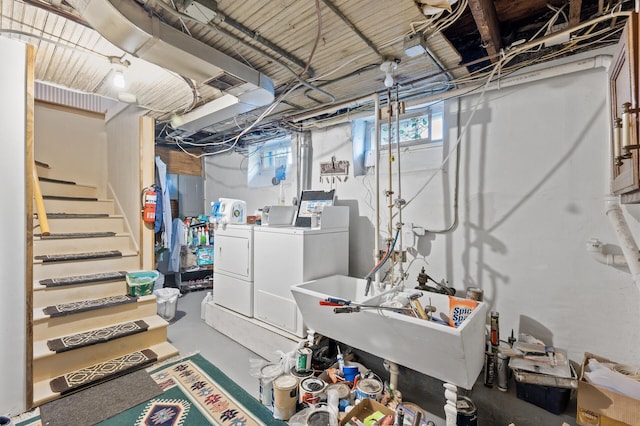 basement with independent washer and dryer and sink