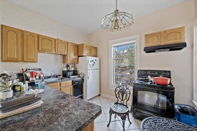 2523 Dupont Ave N, Minneapolis, MN 55411 - kitchen with under cabinet range hood, black appliances, dark countertops, a sink, and light tile patterned flooring