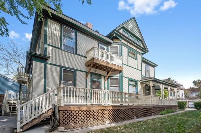 2523 Dupont Ave N, Minneapolis, MN 55411 - back of property with a chimney and a balcony