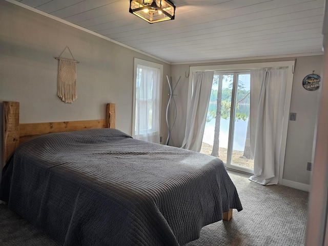 bedroom featuring ornamental molding, access to exterior, wooden ceiling, and carpet