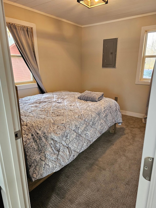 carpeted bedroom featuring ornamental molding and electric panel