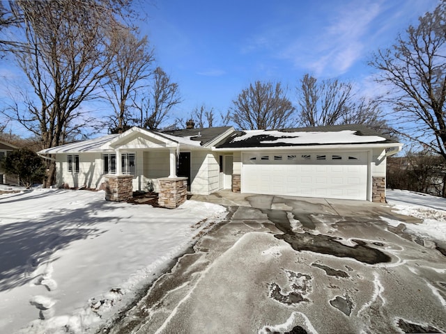 view of front of house featuring stone siding, a chimney, an attached garage, and concrete driveway