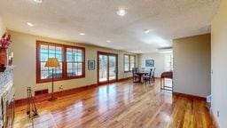 living room featuring hardwood / wood-style flooring and a fireplace