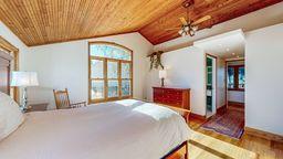 bedroom with lofted ceiling and wood ceiling