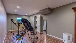 workout room with wood-type flooring