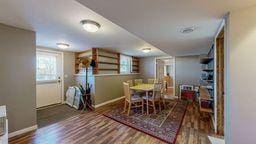 dining space with hardwood / wood-style flooring