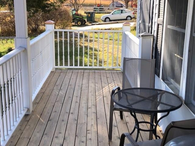 22735 Hickory Rd, Lanesboro, MN 55949 - wooden deck featuring covered porch and outdoor dining space
