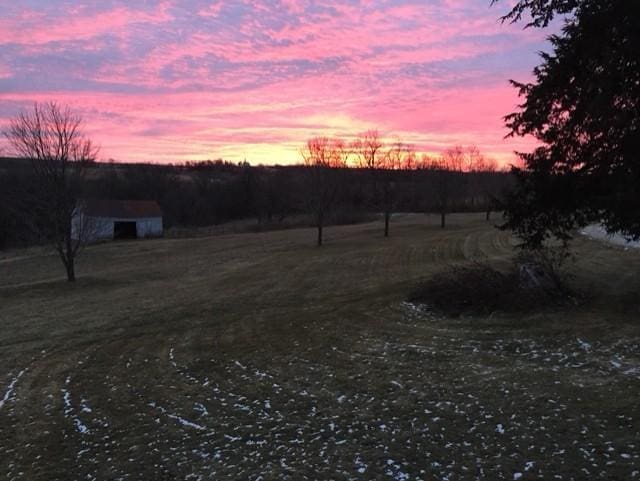 22735 Hickory Rd, Lanesboro, MN 55949 - view of yard featuring a rural view, an outbuilding, and a garage