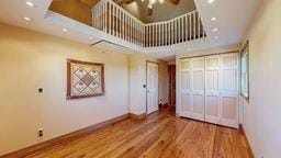22735 Hickory Rd, Lanesboro, MN 55949 - unfurnished living room with baseboards, ceiling fan, wood finished floors, and recessed lighting