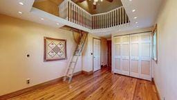 22735 Hickory Rd, Lanesboro, MN 55949 - unfurnished living room featuring baseboards, wood finished floors, ceiling fan, and recessed lighting