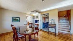22735 Hickory Rd, Lanesboro, MN 55949 - dining space with wood finished floors, stairway, and baseboards