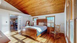 22735 Hickory Rd, Lanesboro, MN 55949 - bedroom with lofted ceiling, wooden ceiling, and wood finished floors