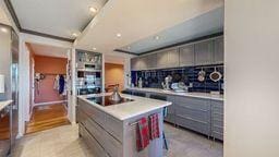 22735 Hickory Rd, Lanesboro, MN 55949 - kitchen featuring gray cabinets, a center island, light countertops, and recessed lighting