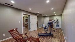 22735 Hickory Rd, Lanesboro, MN 55949 - workout room featuring baseboards, recessed lighting, and wood finished floors