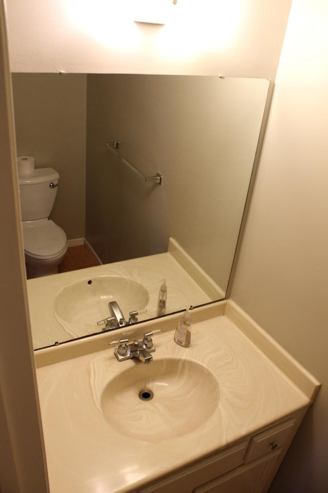 bathroom with vanity and toilet