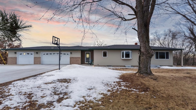 single story home featuring an attached garage, crawl space, and driveway