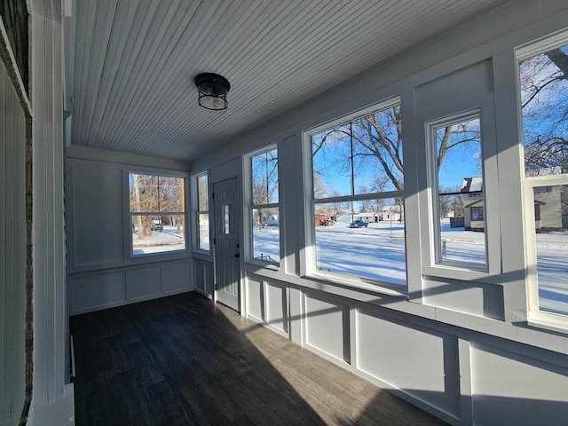 unfurnished sunroom featuring wooden ceiling