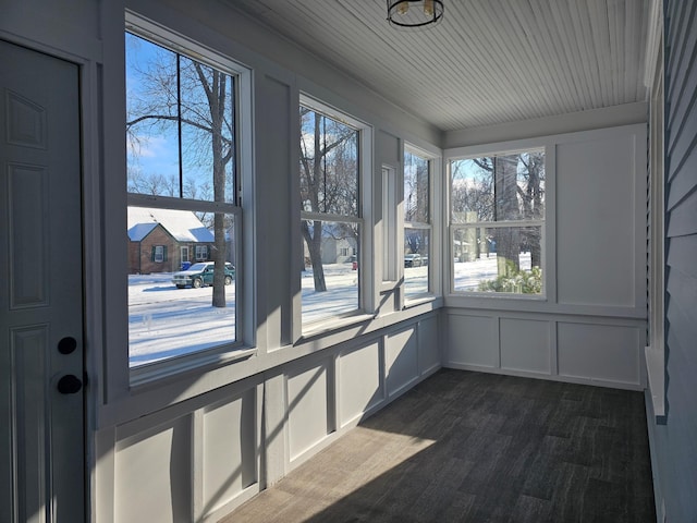 unfurnished sunroom featuring wooden ceiling