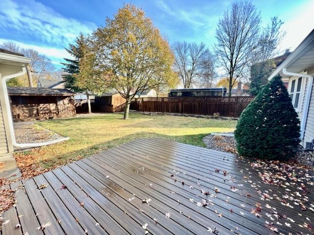 wooden deck with a yard