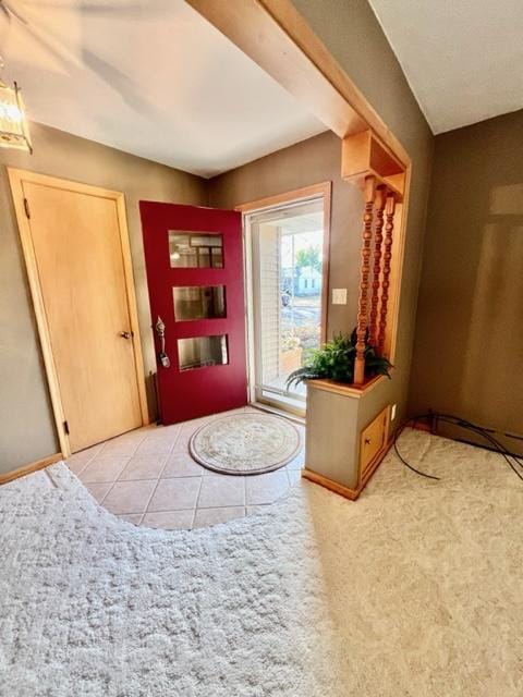 foyer featuring light tile patterned floors