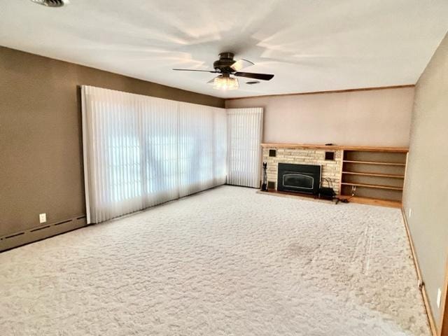 unfurnished living room with ceiling fan and carpet flooring