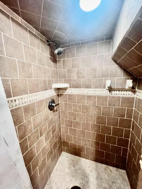 bathroom with tiled shower