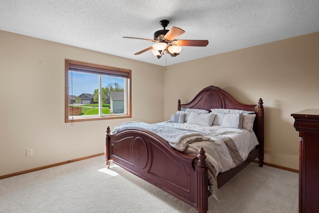 214 15th Ave SE, Lonsdale, MN 55046 - carpeted bedroom featuring baseboards, ceiling fan, and a textured ceiling