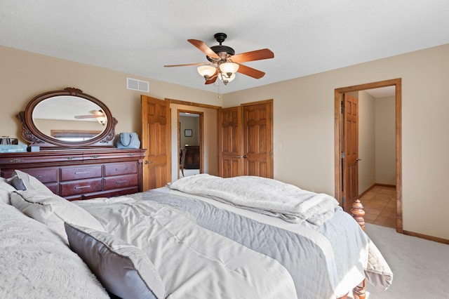 214 15th Ave SE, Lonsdale, MN 55046 - bedroom featuring light carpet, a ceiling fan, and baseboards